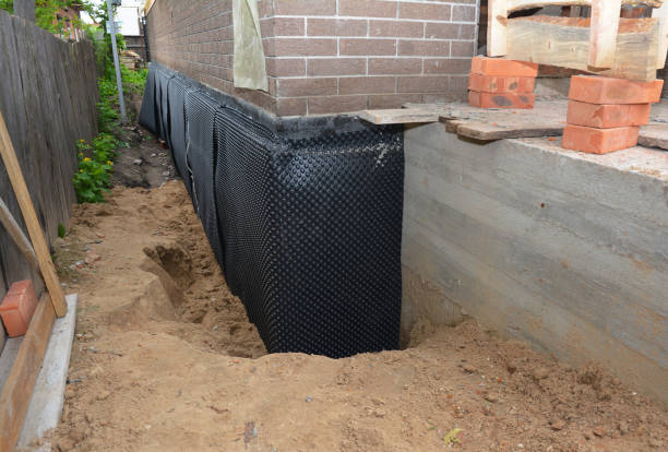 SJ Waterproofing Pros technician performing targeted Basement Waterproofing assessment in Williston Park, NY
